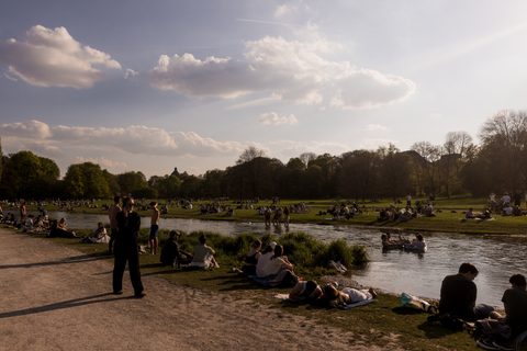 Locals enjoying the sunshine by the Isar River · Munich